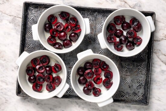 Cherries in 4 ramekins.