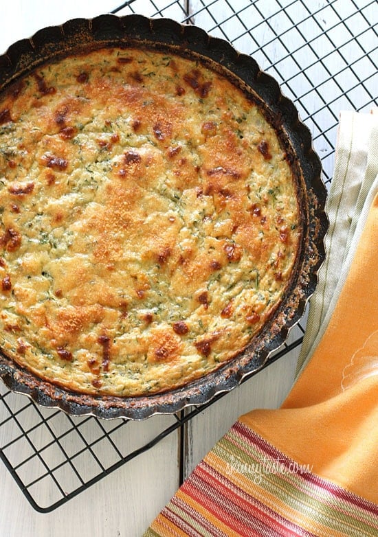 Crustless Summer Zucchini Pie is a simple savory pie made with zucchini, shallots, mozzarella and Parmesan cheese.