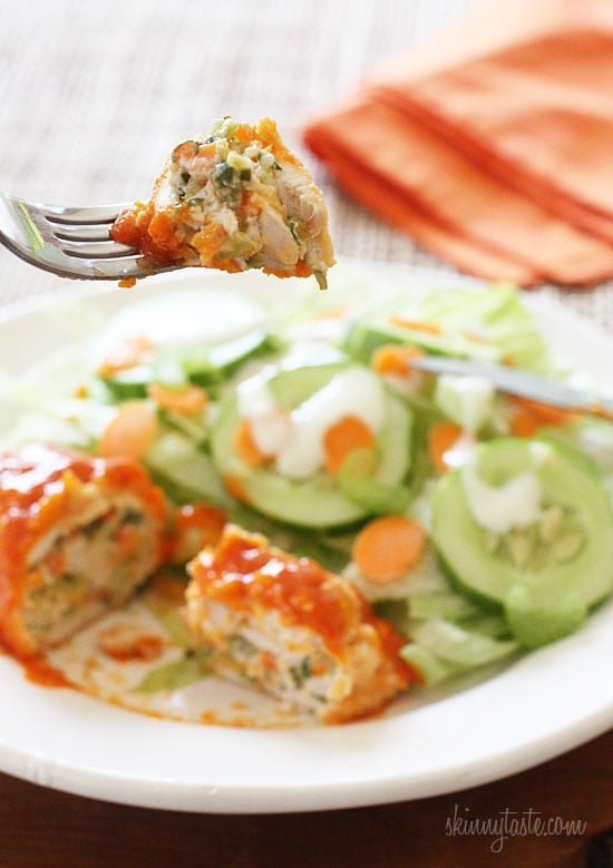 Buffalo Chicken breast stuffed with cheese, shredded carrots and minced celery, then rolled, breaded, baked and drizzled with hot sauce. Sound enticing? It should be, this is good stuff!