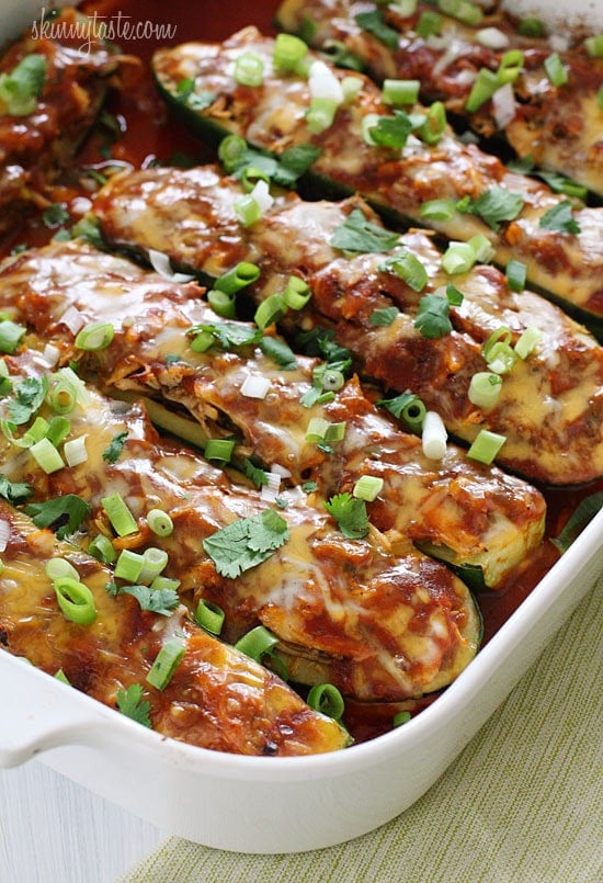 A fun twist on a Mexican favorite! Summer zucchini hollowed out and stuffed with shredded chicken, enchilada sauce, cheese and scallions. Serve this with cilantro lime rice and you'll have yourself a fiesta!