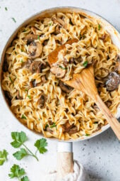 This healthy stroganoff with shiitake, baby portabella, and cremini mushrooms with noodles in a light creamy sauce is a quick and easy meal, perfect for Meatless Mondays!