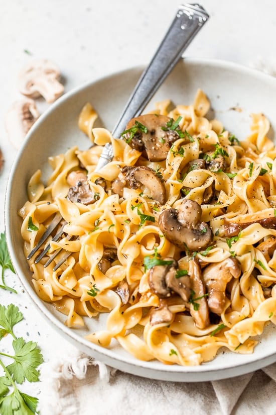 Mushroom Stroganoff in a plate with a fork.