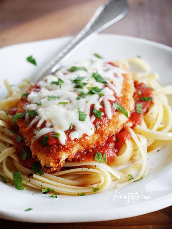 The Best Chicken Parmesan recipe, made a bit healthier! Breaded chicken cutlets are baked, not fried yet the chicken is so moist and full of flavor.