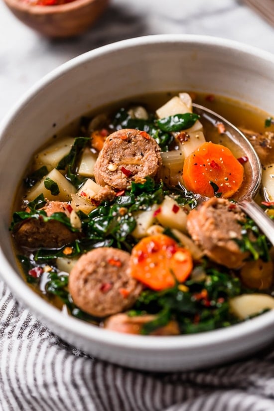Kale and Potato Soup with Turkey Sausage is an easy, hearty soup made with kale, potatoes, carrots and turkey or chicken sausage. 