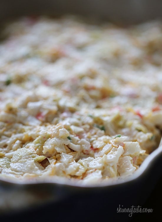 Hot and cheesy imitation crab and artichoke dip is to die for! Serve this glorious dip with baked chips and you will have the perfect appetizer for any party.