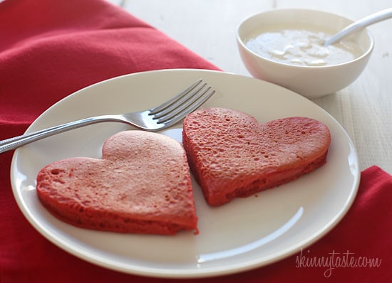 These lightened-up red velvet pancakes are made with a blend of white whole wheat flour and all purpose, then topped with a light cream cheese topping.  I adore red velvet, so I can't think of a more fitting time to make red velvet pancakes, then for Valentine's Day!