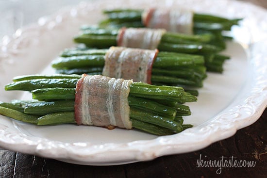 Pretty little bundles of bacon wrapped French "green beans" known as Haricot verts which are longer and thinner than the typical American green beans. Of course, American green beans will work just fine here too.