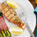 Salmon fillets seasoned with a garlic, Dijon herb sauce and served with a squeeze of fresh lemon... delicious!!