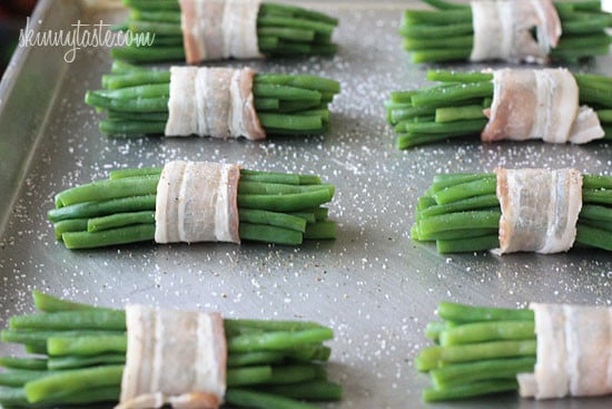 Pretty little bundles of bacon wrapped French "green beans" known as Haricot verts which are longer and thinner than the typical American green beans. Of course, American green beans will work just fine here too.