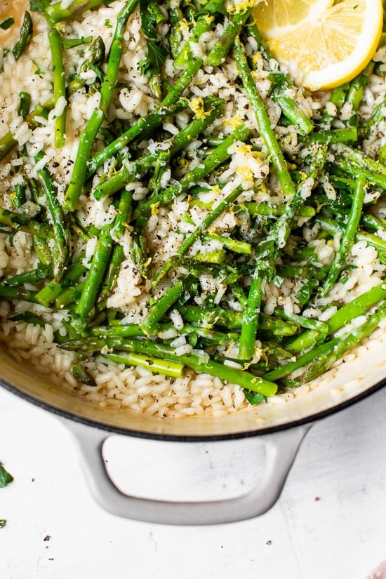 Creamy asparagus risotto, cooked with fresh herbs, Parmigiano-Reggiano and a touch of lemon. Perfect Spring meatless main dish or wonderful topped with grilled shrimp or scallops.