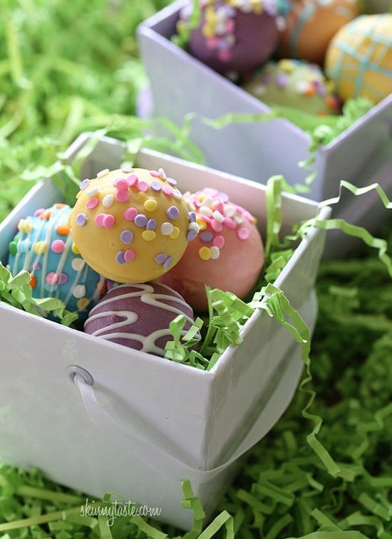 These Easter Egg cake balls are such a fun Easter dessert idea! Made lighter by using a box cake mix, egg whites and fat free Greek yogurt – no oil, no butter required!