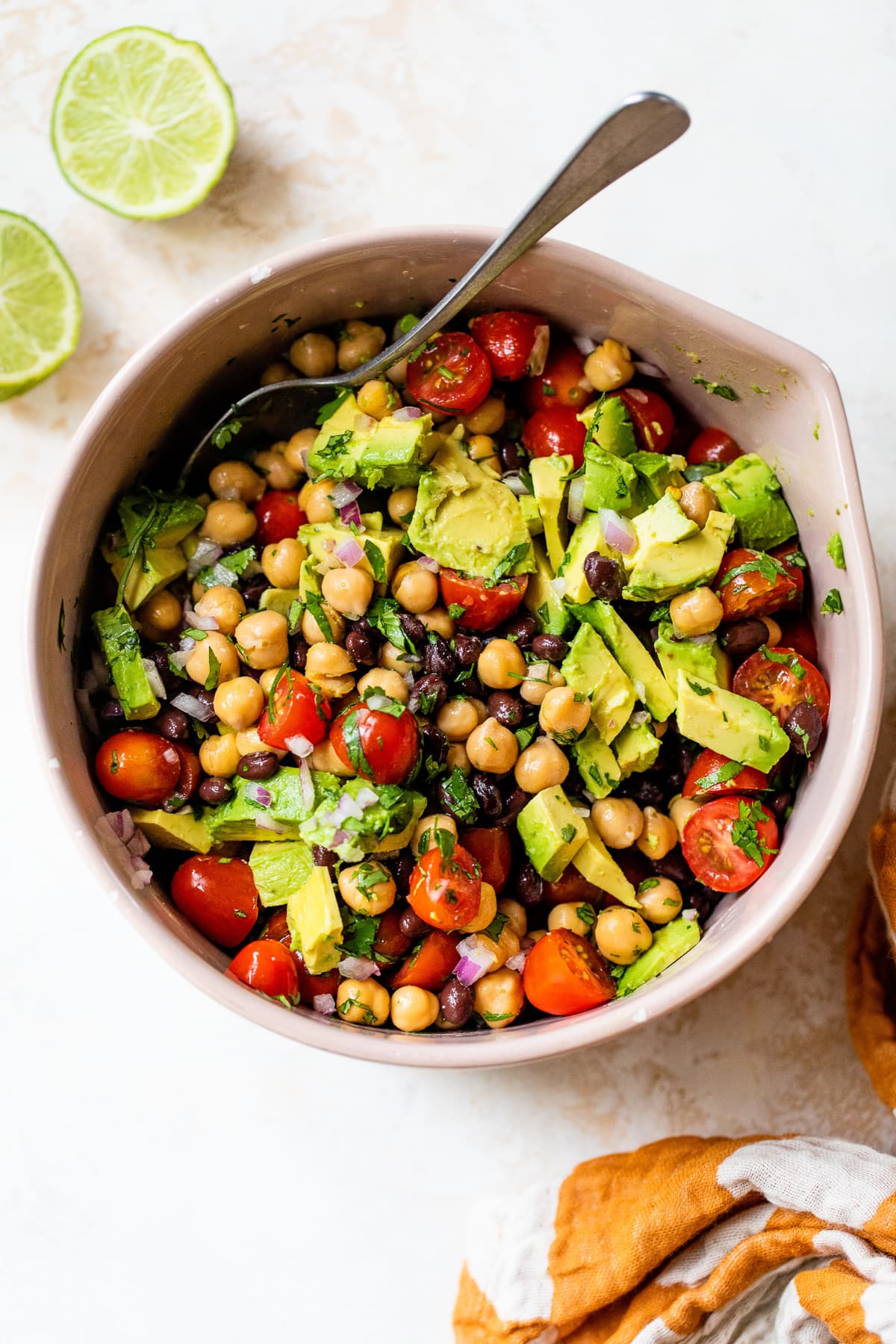 Black beans, chickpeas, avocado and tomato with lime