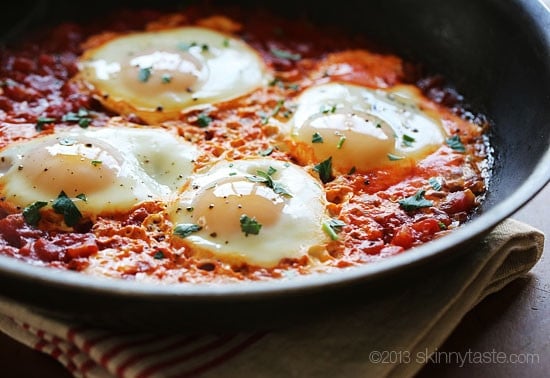 Harissa eggs in purgatory is a simple Italian egg dish, simmered in a fiery tomato sauce. Tastes like heaven if you need a quick inexpensive meal with a kick!