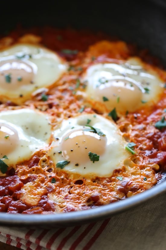 Harissa eggs in purgatory is a simple Italian egg dish, simmered in a fiery tomato sauce. Tastes like heaven if you need a quick inexpensive meal with a kick!