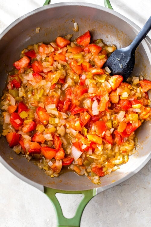 tomatoes and onions in skillet