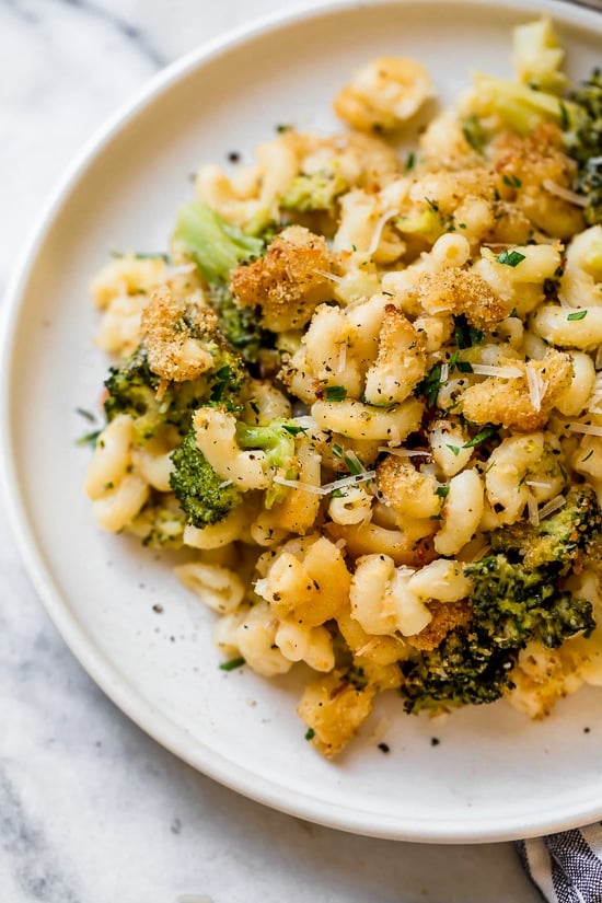 This homemade, lightened up baked mac and cheese recipe adds broccoli to the mix, a great way to sneak veggies in a kid's favorite dish!