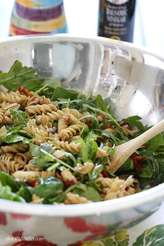 I love making this mayo-less summer pasta salad with arugula, spinach, sun dried tomatoes, capers, fresh shaved Parmesan cheese and a splash of balsamic and oil.
