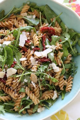 I love making this mayo-less summer pasta salad with arugula, spinach, sun dried tomatoes, capers, fresh shaved Parmesan cheese and a splash of balsamic and oil.