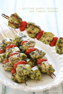 Grilled Pesto Chicken and Tomato Kebabs just SCREAM summer, made with chunks of boneless chicken breasts, skinny basil pesto and grape tomatoes. Serve this as an appetizer at your next backyard bash, or have them for dinner any night of the week with a great big salad or over pasta.