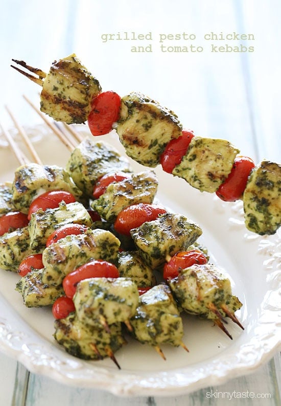 Grilled Pesto Chicken and Tomato Kebabs just SCREAM summer, made with chunks of boneless chicken breasts, skinny basil pesto and grape tomatoes. Serve this as an appetizer at your next backyard bash, or have them for dinner any night of the week with a great big salad or over pasta.
