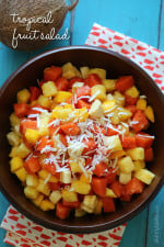This tropical fruit salad, made with fresh papaya, mango, pineapple, bananas and grated coconut is the best tasting fruit salad... EVER!!