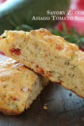 Light and biscuit-like savory scones made with a blend of whole wheat and white flour, shredded zucchini, sun dried tomato, Asiago cheese and fresh rosemary.
