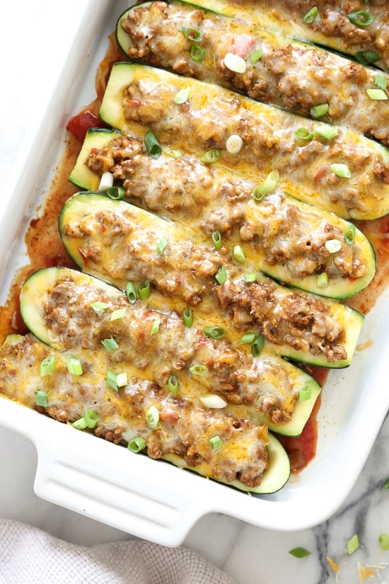 For a low-carb, summer spin on taco night, you'll love these Taco Stuffed Zucchini Boats filled with seasoned ground turkey and topped with a Mexican cheese blend.