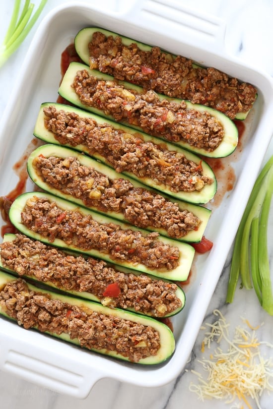 For a low-carb, summer spin on taco night, you'll love these Taco Stuffed Zucchini Boats filled with seasoned ground turkey and topped with a Mexican cheese blend.
