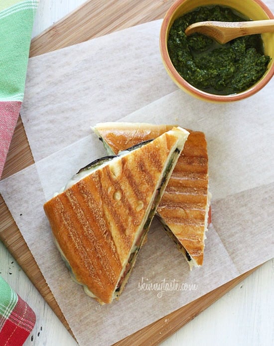 A perfect summer lunch panini made with eggplant, tomatoes, mozzarella and skinny pesto on crispy French bread. Make this for one, or for the whole family.