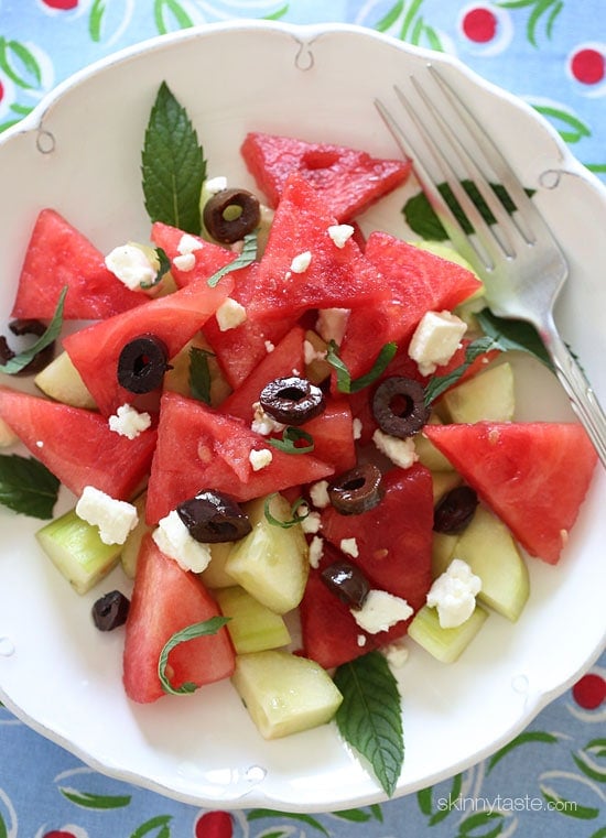 Chilled Watermelon Cucumber Feta Salad tossed with Kalamata olives, fresh mint and a drizzle of balsamic glaze – refreshing, light and delicious!
