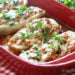 A fun, easy twist on eggplant parmesan – these baked eggplant "boats" are hollowed out and stuffed with chicken sausage, tomato sauce and mozzarella.