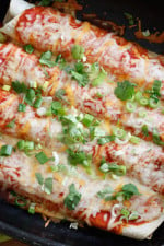 Cheesy meatless enchiladas filled with zucchini and cheese, topped with my homemade enchilada sauce –so delicious whether you are vegetarian or not.