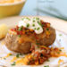 This loaded baked potato is stuffed with lean turkey chili, reduced fat shredded cheese and topped with some fresh chives – a quick, easy weeknight meal.