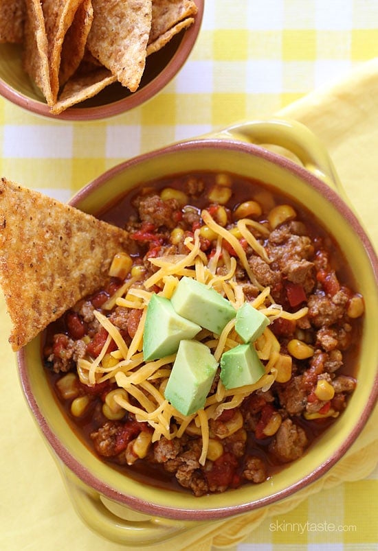 This CrockPot turkey chili recipe is just for the kiddos (or picky family members)! A kid-friendly chili with ground turkey, corn, bell pepper, tomatoes and spices. Serve it with some chips on the side for the perfect back to school lunch.