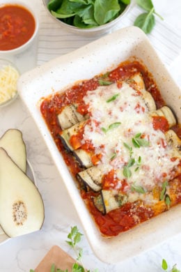 The best low-carb Eggplant Rollatini, made with thin slices of eggplant filled with a spinach and cheese ricotta filling, topped with marinara and mozzarella cheese. No frying, no breadcrumbs!