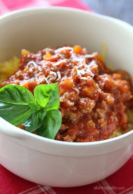 Spaghetti Squash with Meat Ragu is my go-to spaghetti squash meal! Roasted Spaghetti Squash topped with a simple-yet-delicious meat sauce simmered with tomatoes, onions, carrots and celery. It's so good, you won't miss the pasta!