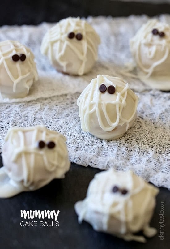 Easy Skinny Halloween mummy cake balls made light by using a box cake mix, egg whites and fat free Greek yogurt – no butter required!