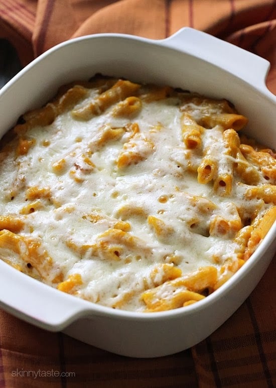 Cheesy Baked Pumpkin Pasta – the dish that got my family to like whole wheat pasta! Made with pumpkin, bacon, shallots, pecorino cheese and a touch of rosemary then topped with mozzarella cheese. You can also make this gluten-free!