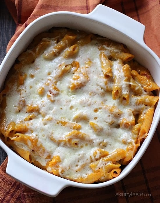 Cheesy Baked Pumpkin Pasta – the dish that got my family to like whole wheat pasta! Made with pumpkin, bacon, shallots, pecorino cheese and a touch of rosemary then topped with mozzarella cheese. You can also make this gluten-free!