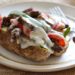 Quick skillet steak with onions, peppers, mushrooms loaded on top of a baked potato and topped with melted cheese – this loaded Philly cheesesteak baked potato is perfect for the meat and potato lover in your life!