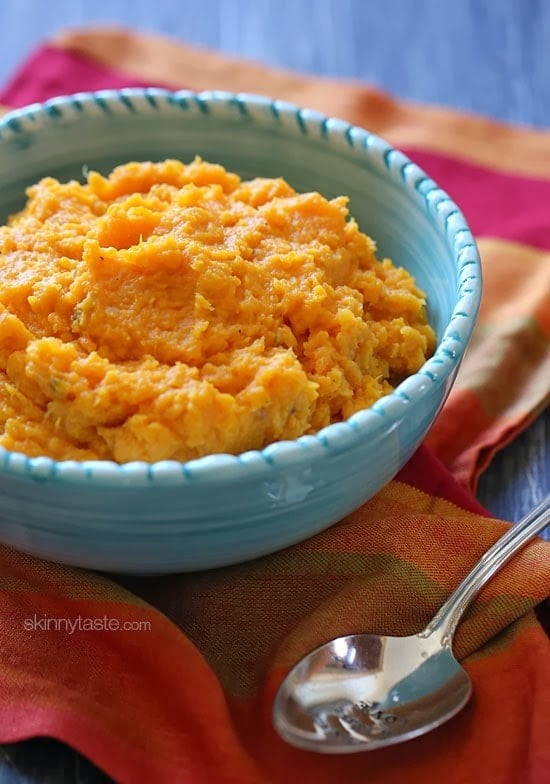 A savory slow cooker garlic mashed sweet potatoes recipe that's the perfect addition to your turkey dinner – let your slow cooker help you out in the kitchen this Thanksgiving!
