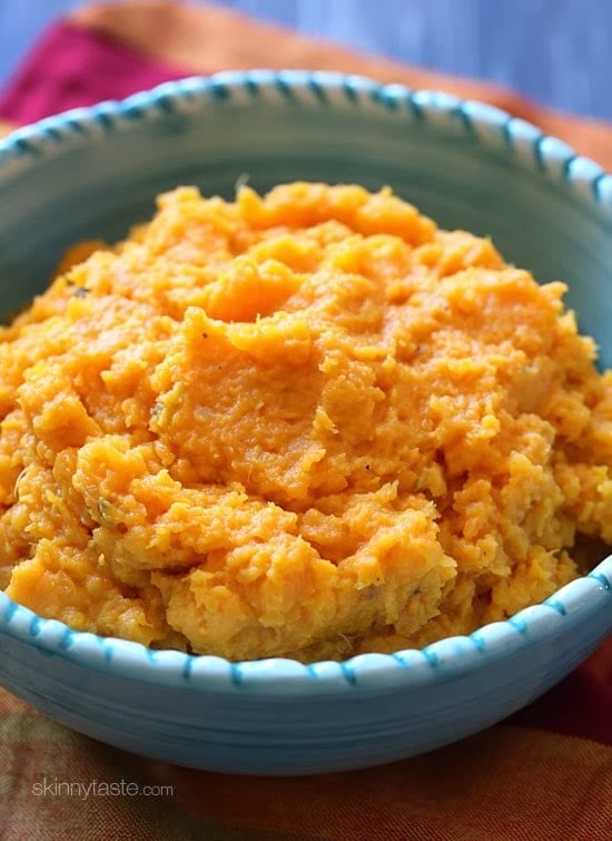 A savory slow cooker garlic mashed sweet potatoes recipe that's the perfect addition to your turkey dinner – let your slow cooker help you out in the kitchen this Thanksgiving!
