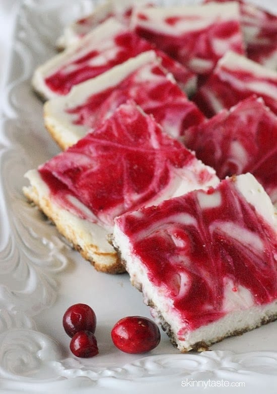 Cranberry Swirl Cheesecake Squares with a gingersnap pecan crust – so good, less guilt and perfect for the Holidays!