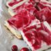 Cranberry Swirl Cheesecake Squares with a gingersnap pecan crust – so good, less guilt and perfect for the Holidays!