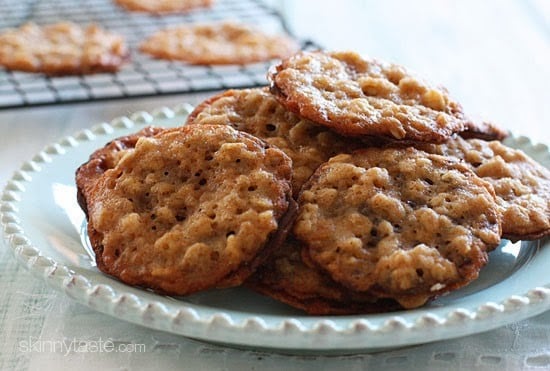 These delicious dark chocolate oatmeal lace cookies are light, crisp and chewy, sandwiched together with melted dark chocolate.