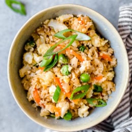 Bowl of cauliflower fried rice with eggs.