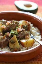 Crock pot carne guisada is a slow cooked Latin beef stew with baby red potatoes and Latin seasonings. Serve this topped with fresh aji picante – it's a must and really brightens the flavors and rounds out the dish!