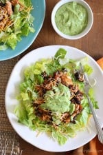 This simple slow cooker chicken taco salad is high in fiber and protein which means it's very satisfying – all for under 300 calories. Trust me, you won't miss the tortillas!