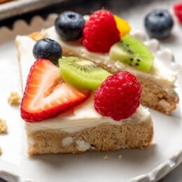 Two fruit pizza pieces on plate