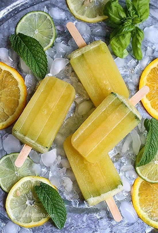 These Citrus Basil Mojito ice pops are the perfect balance of orange, lemon and lime, plus I added fresh mint and basil from my garden which adds just a hint of flavor inspired by my favorite cocktail – mojitos! You can make these with or without the rum, I made them without so I can share them with my toddler.